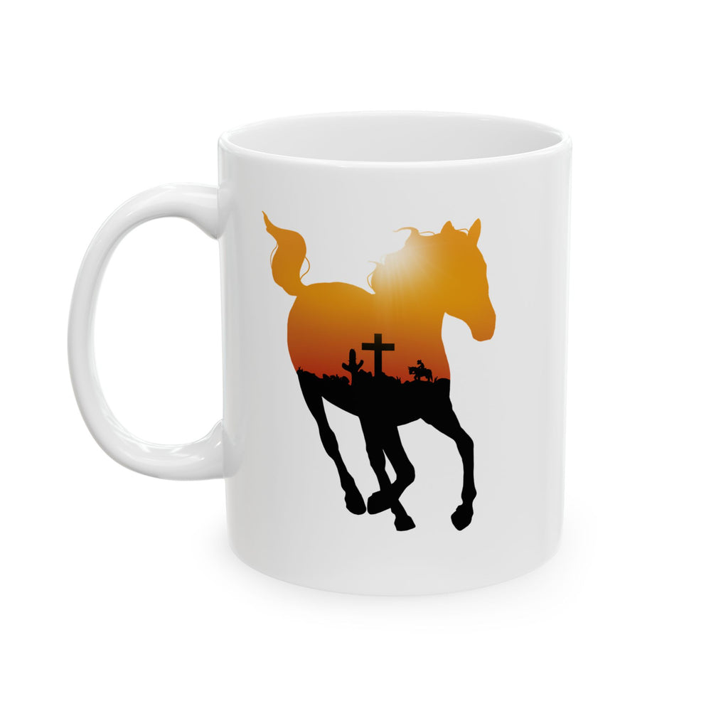 Mockup of a coffee mug featuring the silhouette of a running horse with an orange sky and crow outline in it